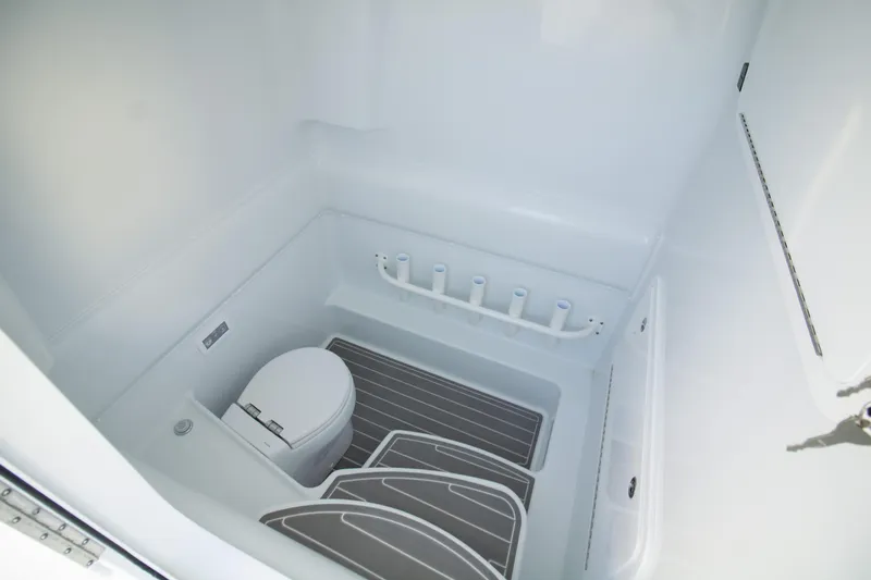  Yacht Photos Pics 2024 Yellowfin 39 boat interior with toilet and storage space.