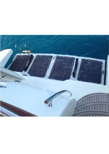  Yacht Photos Pics Canados 86 Fly 2005 yacht swim platform with solar panels and ladder.