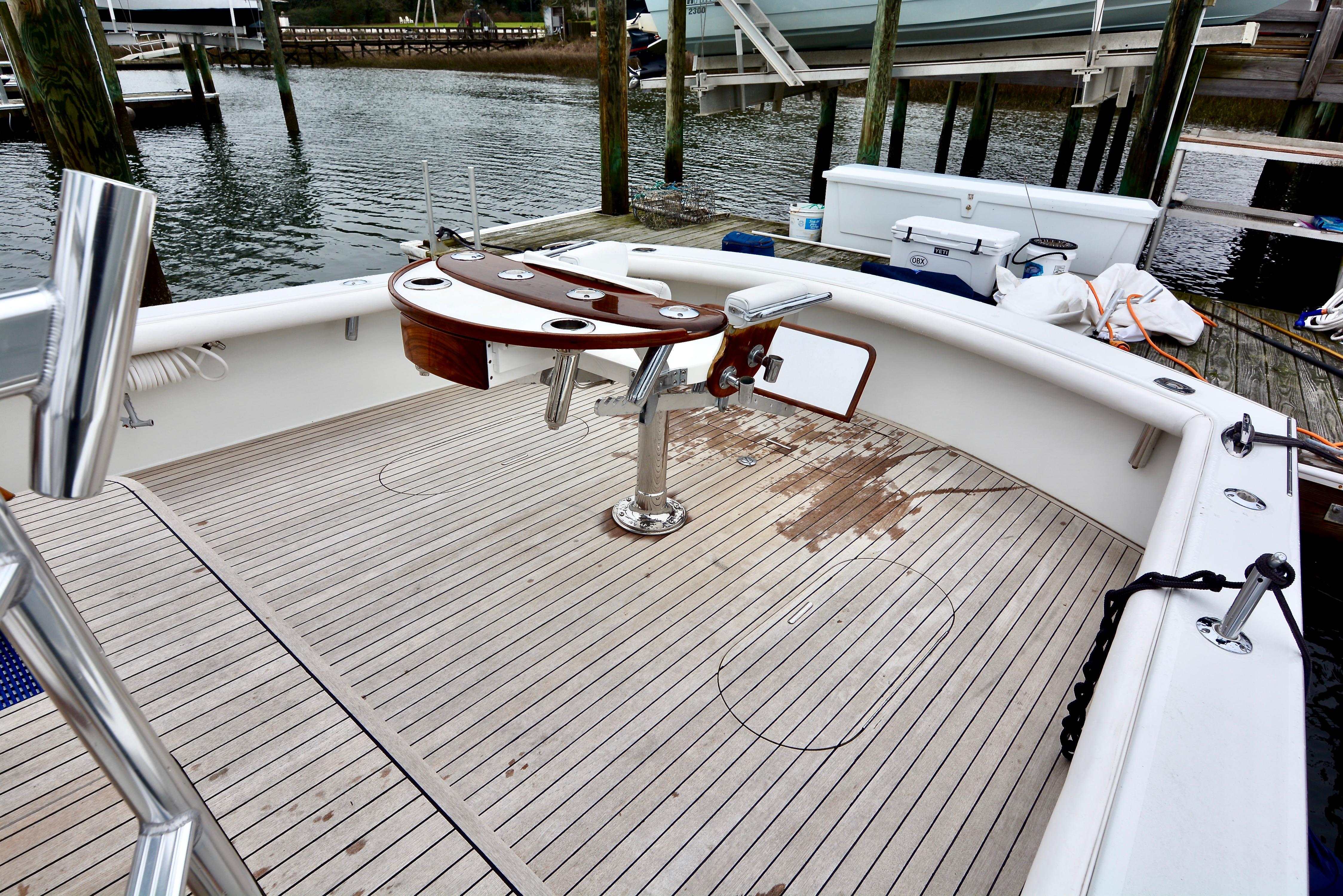 2007 Gamefisherman 42 Walkaround boat deck with fishing chair and rod holders.
