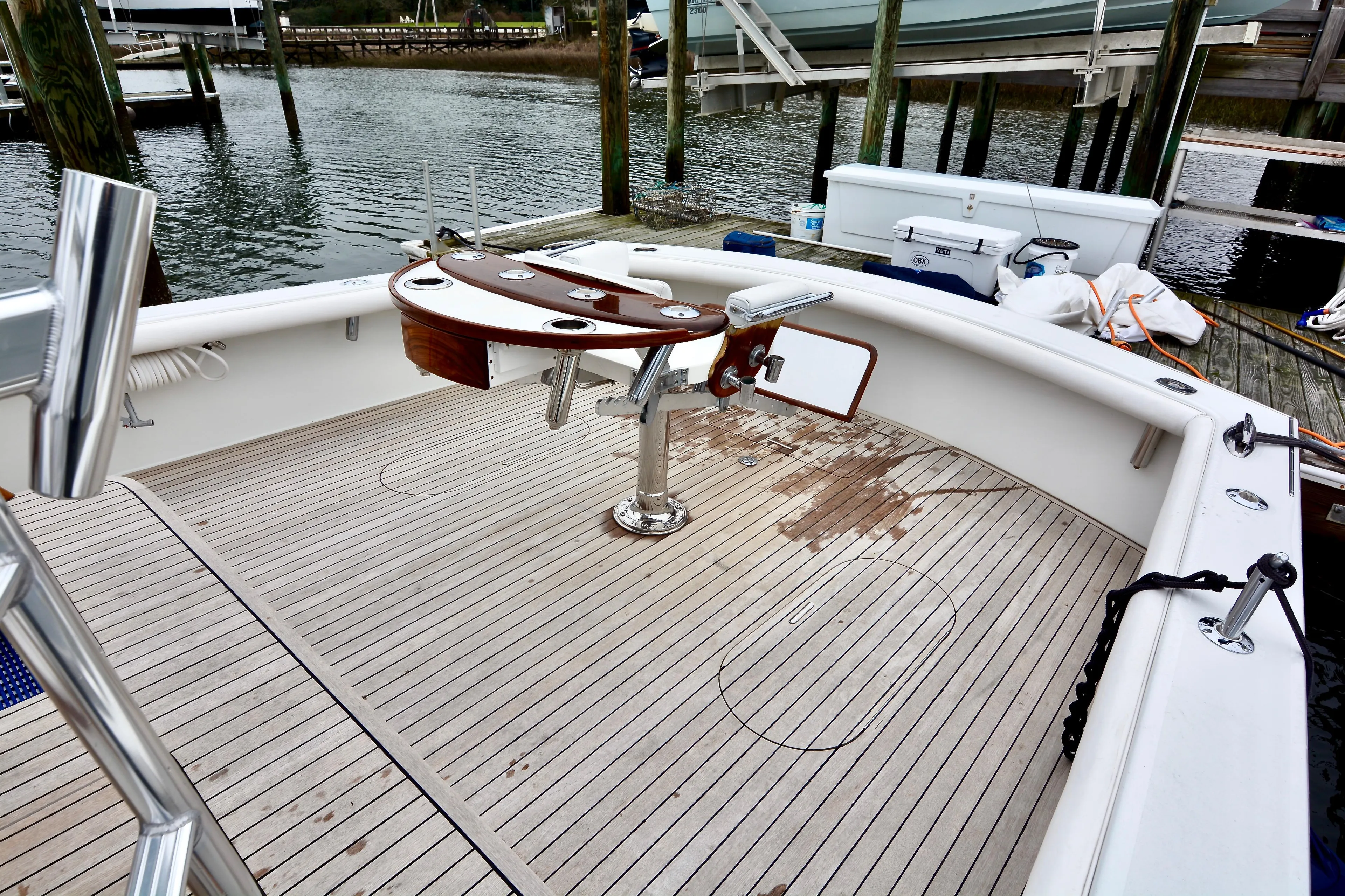 2007 Gamefisherman 42 Walkaround boat deck with fishing chair and rod holders.