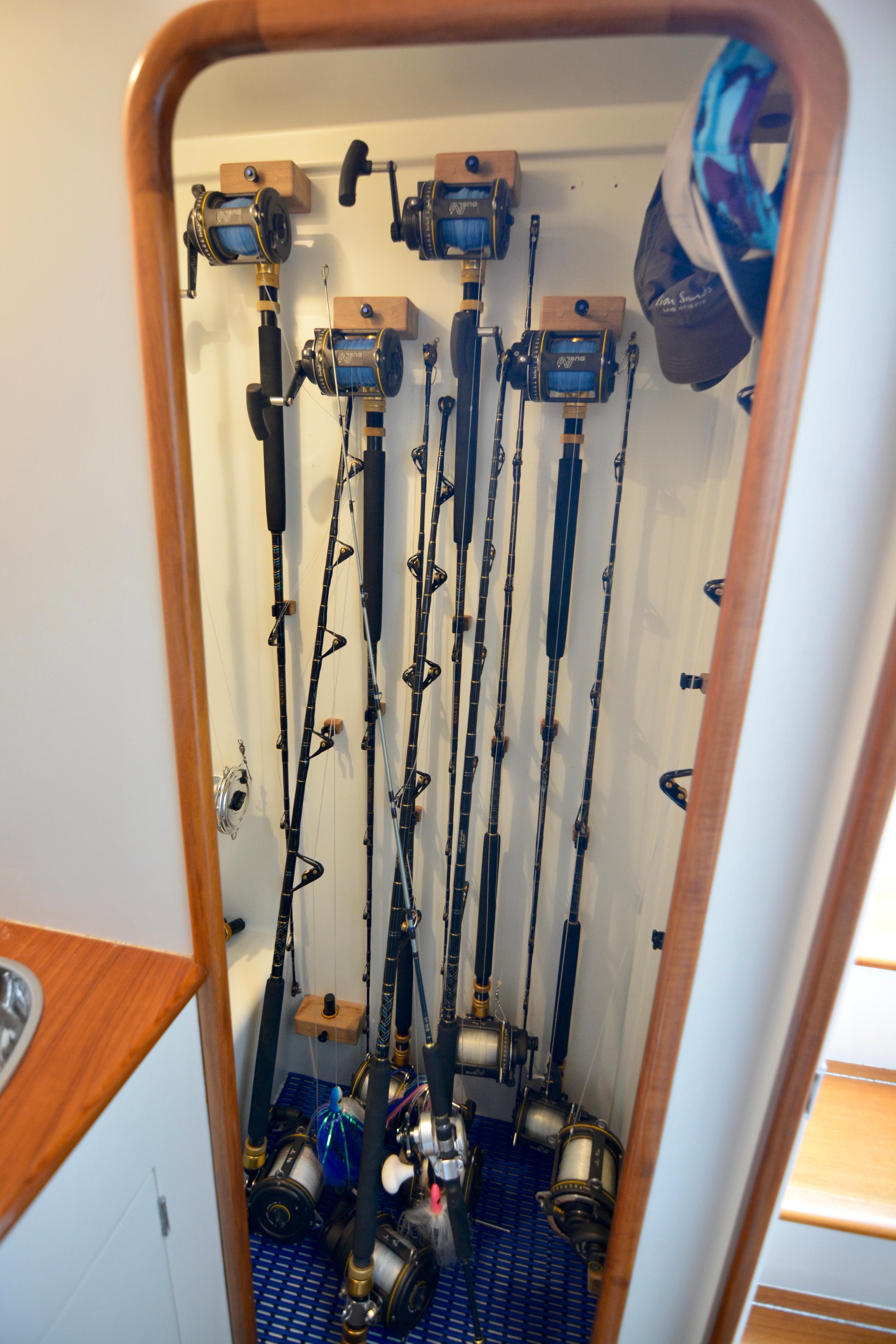 Fishing rods stored vertically in a 2007 Gamefisherman 42 Walkaround boat interior.