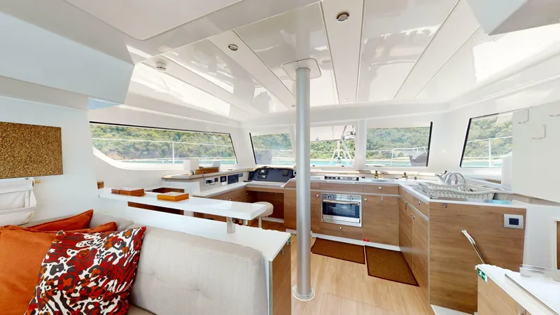 Aquatic Odyssey Yacht Photos Pics Luxurious interior of 2022 Bali CATSPACE catamaran with modern kitchen and scenic views.