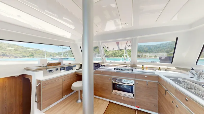 Aquatic Odyssey Yacht Photos Pics Modern kitchen interior of 2022 Bali CATSPACE catamaran with scenic ocean view.