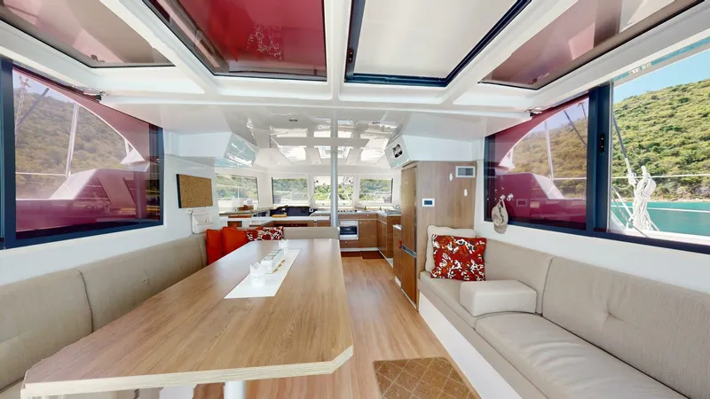 Aquatic Odyssey Yacht Photos Pics Luxurious interior of 2022 Bali CATSPACE catamaran with spacious seating and panoramic windows.