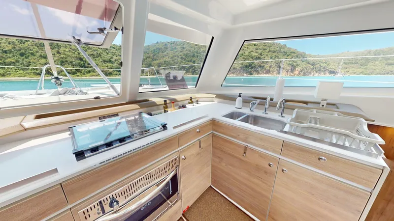 Aquatic Odyssey Yacht Photos Pics Modern kitchen interior on 2022 Bali CATSPACE yacht with scenic ocean view.