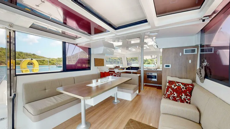 Aquatic Odyssey Yacht Photos Pics Modern interior of 2022 Bali CATSPACE catamaran with spacious seating and dining area.