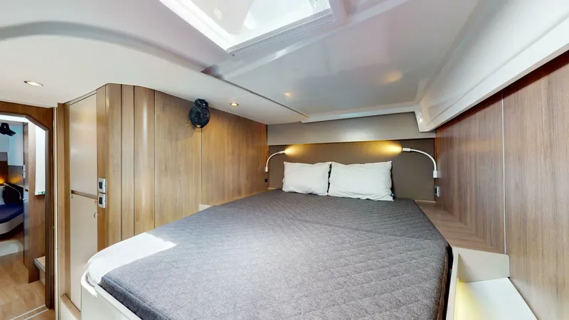 Aquatic Odyssey Yacht Photos Pics Luxurious cabin interior of 2022 Bali CATSPACE catamaran with cozy bed and modern design.