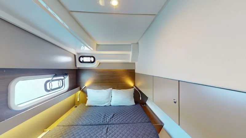 Aquatic Odyssey Yacht Photos Pics 2022 Bali CATSPACE cabin interior with cozy bed, modern design, and ambient lighting.