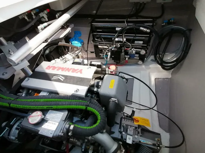 Aquatic Odyssey Yacht Photos Pics Engine compartment of a 2022 Bali CATSPACE, featuring a Yanmar engine and various mechanical components.