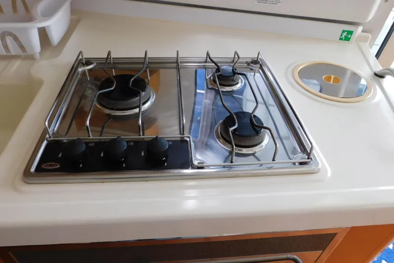 Sail La Vie Yacht Photos Pics Stove in 2007 Fountaine Pajot Mahe 36 Evolution yacht kitchen.