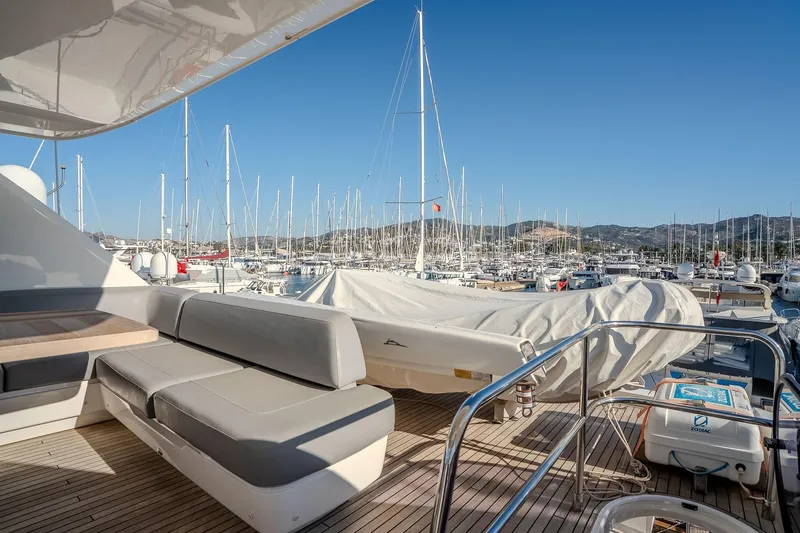 Dani Yacht Photos Pics Luxurious 2016 Princess 68 yacht deck with marina view, featuring comfortable seating.