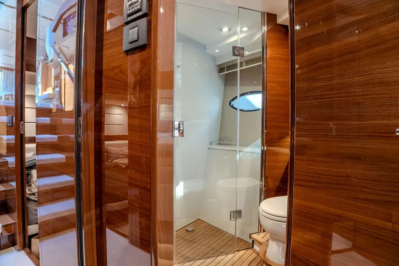 Dani Yacht Photos Pics Luxurious 2016 Princess 68 yacht interior with wooden finishes and modern bathroom.