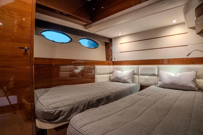 Dani Yacht Photos Pics Luxurious twin cabin interior on 2016 Princess 68 yacht with elegant wood finish.
