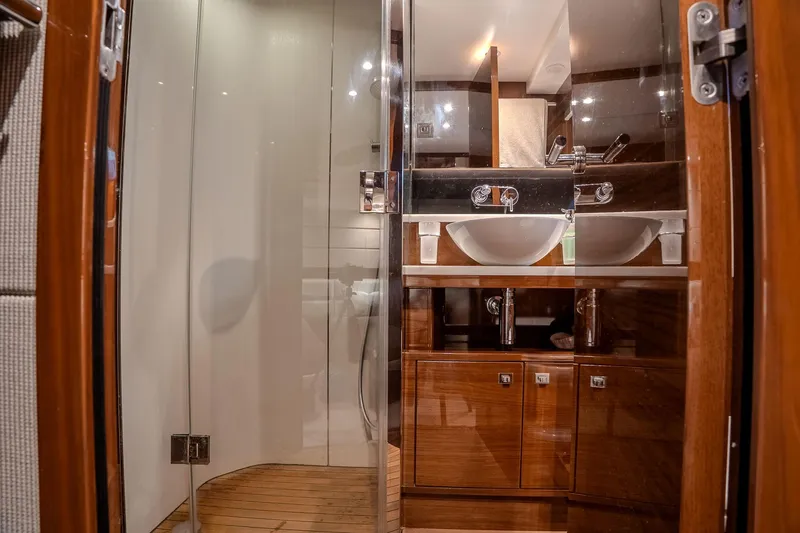 Dani Yacht Photos Pics Luxurious bathroom in 2016 Princess 68 yacht with dual sinks and glass shower.