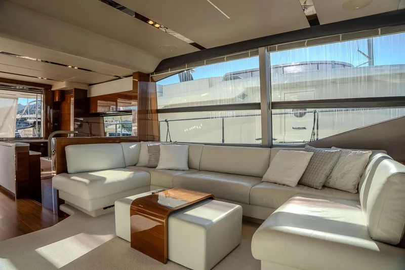 Dani Yacht Photos Pics Luxurious interior of 2016 Princess 68 yacht with elegant white seating and wooden accents.