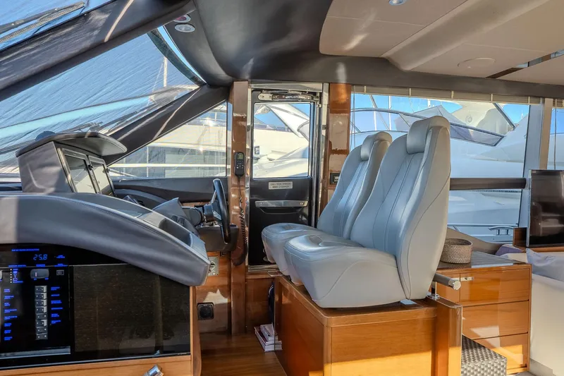 Dani Yacht Photos Pics Interior of 2016 Princess 68 yacht with modern helm and luxurious seating.