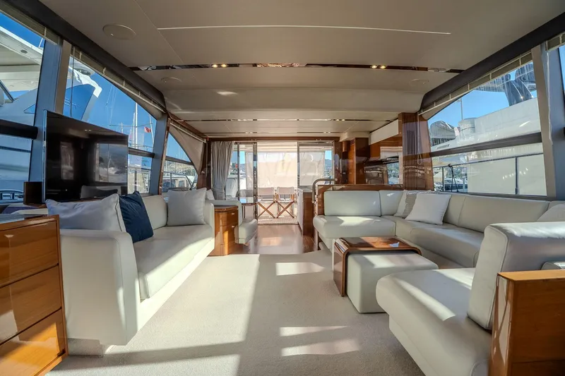 Dani Yacht Photos Pics Luxurious interior of a 2016 Princess 68 yacht with elegant seating and panoramic windows.