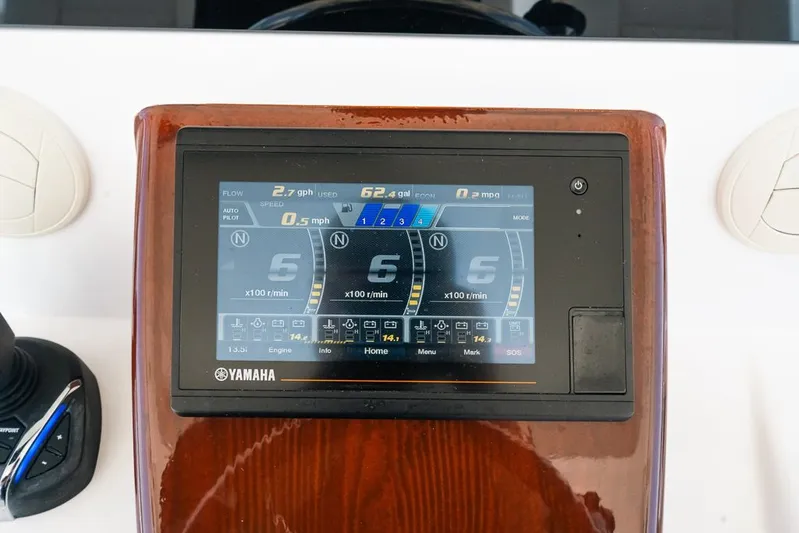 Caymas Yacht Photos Pics Yamaha display on 2023 Caymas 401CC boat dashboard, showing engine metrics.