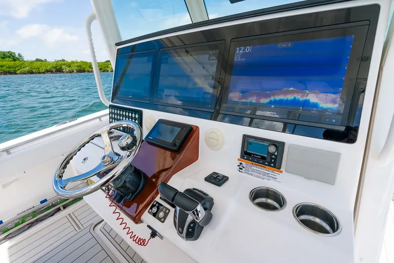 Caymas Yacht Photos Pics 2023 Caymas 401CC boat dashboard with advanced navigation screens and controls.