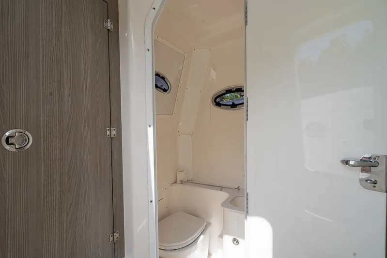 Caymas Yacht Photos Pics Interior view of 2023 Caymas 401CC boat bathroom with modern fixtures.