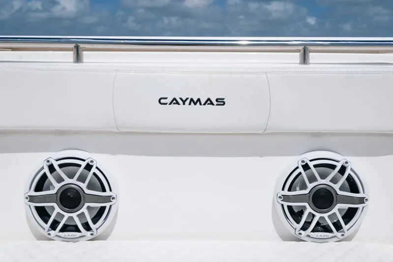 Caymas Yacht Photos Pics 2023 Caymas 401CC boat speakers with logo, under a clear blue sky.