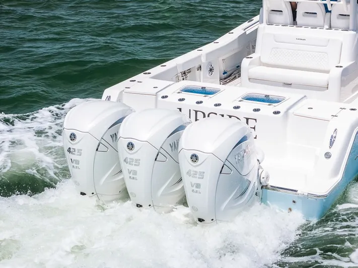Caymas Yacht Photos Pics 2023 Caymas 401CC boat with triple Yamaha 425 V8 engines on the water.