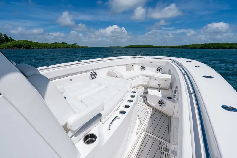 Caymas Yacht Photos Pics 2023 Caymas 401CC boat interior with luxurious seating on open water.