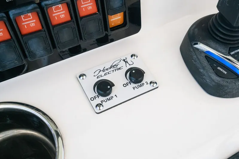 Caymas Yacht Photos Pics Control panel of 2023 Caymas 401CC boat with pump switches and joystick.