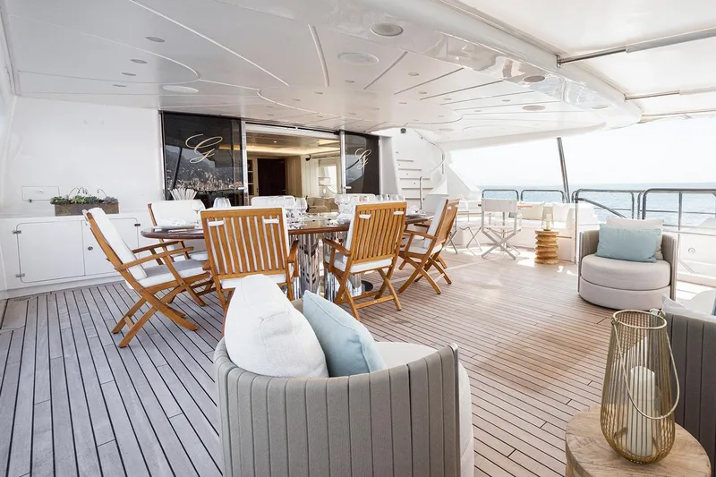 Georgia I Yacht Photos Pics Luxurious deck of 2009 Benetti Classic 120 yacht with elegant seating and ocean view.