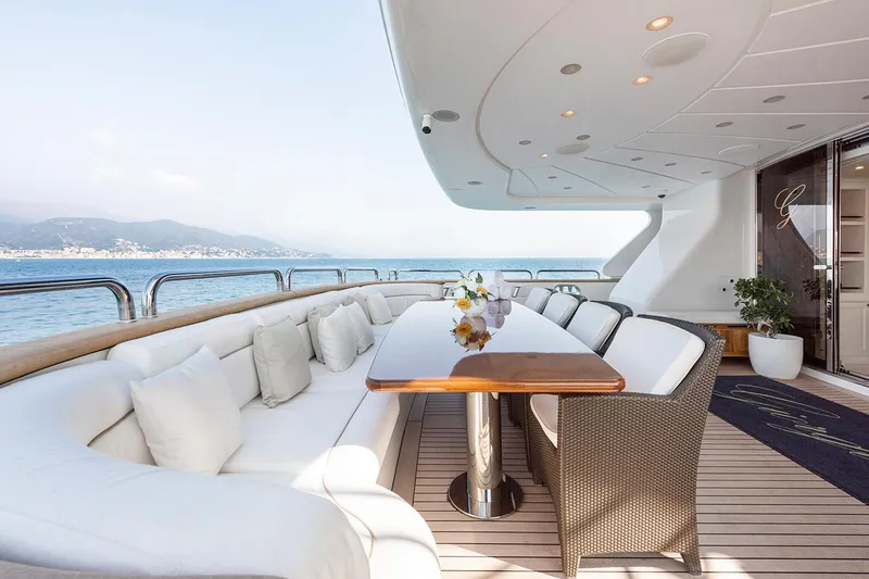 Georgia I Yacht Photos Pics Luxurious deck of 2009 Benetti Classic 120 yacht with elegant seating and ocean view.