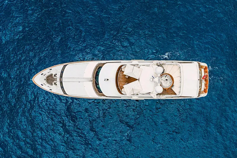 Georgia I Yacht Photos Pics Aerial view of 2009 Benetti Classic 120 yacht on deep blue ocean.