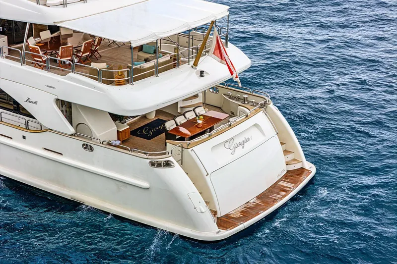 Georgia I Yacht Photos Pics Luxury Benetti Classic 120 yacht from 2009 on open water, featuring elegant deck design.