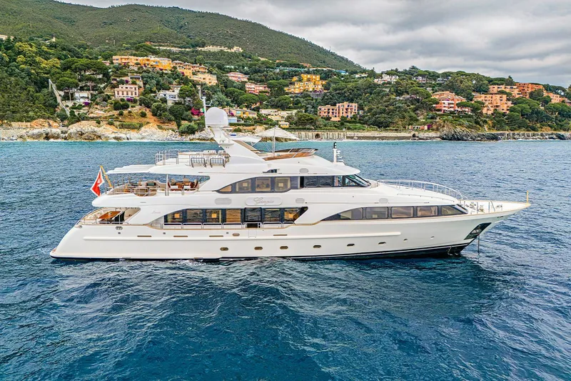 Georgia I Yacht Photos Pics Luxury Benetti Classic 120 yacht from 2009 cruising near scenic coastal landscape.