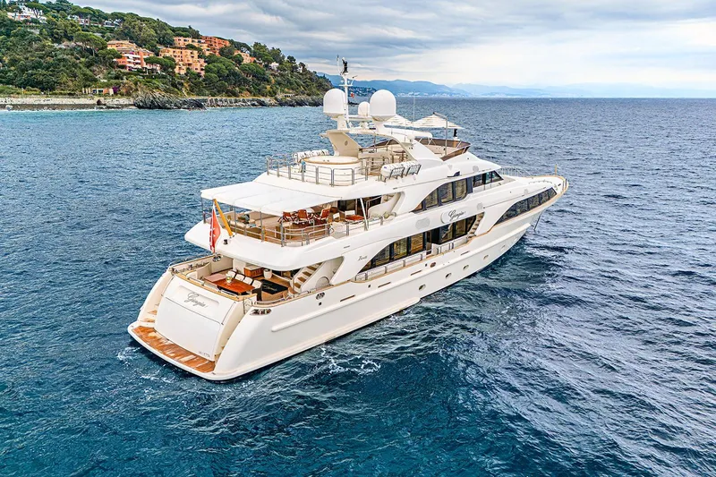 Georgia I Yacht Photos Pics Luxury Benetti Classic 120 yacht cruising near scenic coastline, 2009 model.