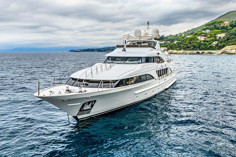 Georgia I Yacht Photos Pics Luxury Benetti Classic 120 yacht from 2009 cruising near a scenic coastline.