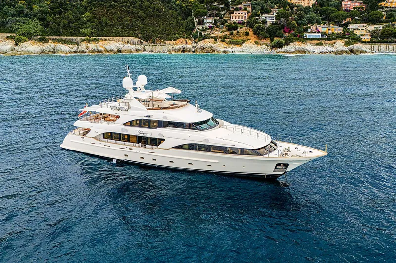 Georgia I Yacht Photos Pics Luxury 2009 Benetti Classic 120 yacht cruising near scenic coastline.