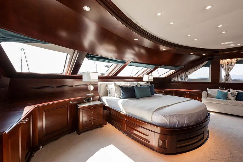 Georgia I Yacht Photos Pics Luxurious bedroom interior of 2009 Benetti Classic 120 yacht with elegant wood finishes.