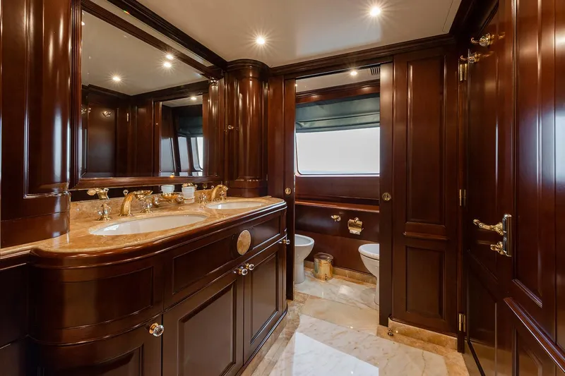 Georgia I Yacht Photos Pics Luxurious bathroom with wooden cabinetry on a 2009 Benetti Classic 120 yacht.