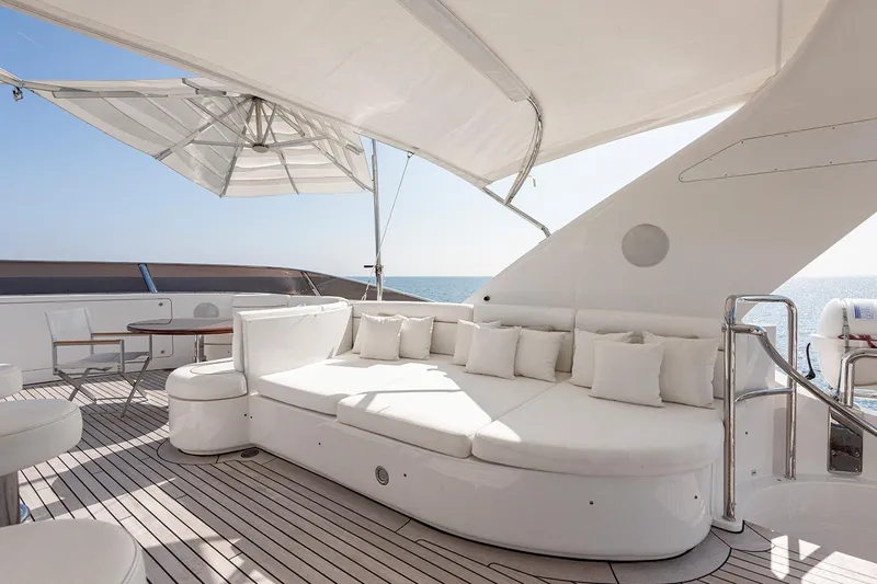 Georgia I Yacht Photos Pics Luxurious deck of 2009 Benetti Classic 120 yacht with elegant seating and ocean view.