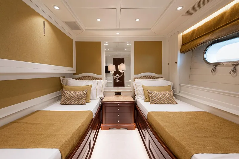 Georgia I Yacht Photos Pics Luxurious twin cabin interior on 2009 Benetti Classic 120 yacht, featuring elegant decor and ambient lighting.