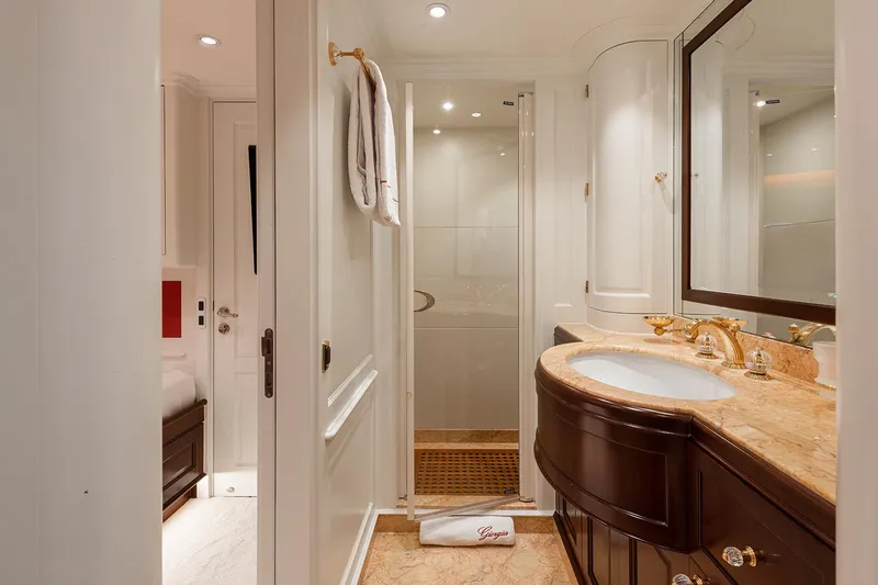 Georgia I Yacht Photos Pics Luxurious bathroom on 2009 Benetti Classic 120 yacht with elegant fixtures and marble countertop.