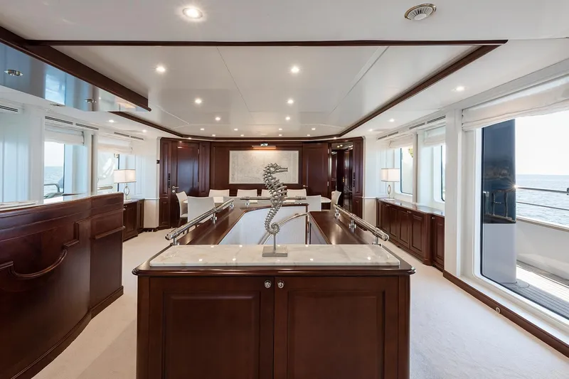 Georgia I Yacht Photos Pics Luxurious interior of 2009 Benetti Classic 120 yacht with elegant wood finishes and ocean view.