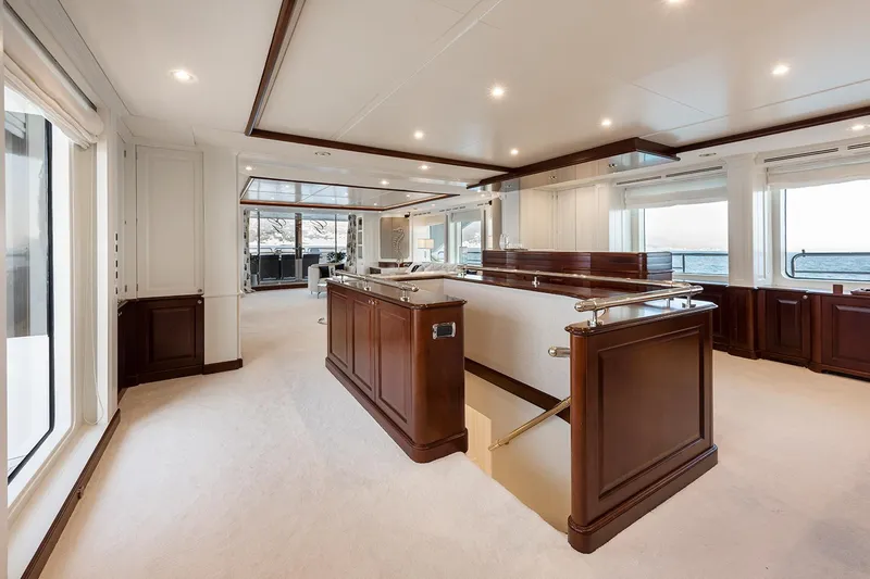 Georgia I Yacht Photos Pics Luxurious interior of 2009 Benetti Classic 120 yacht with elegant wood finishes and ocean view.