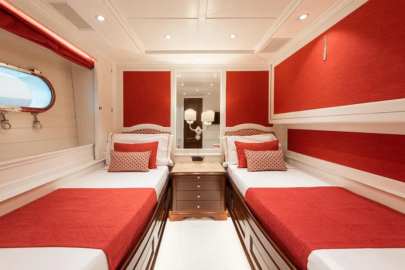 Georgia I Yacht Photos Pics Luxurious twin cabin with red accents on 2009 Benetti Classic 120 yacht.