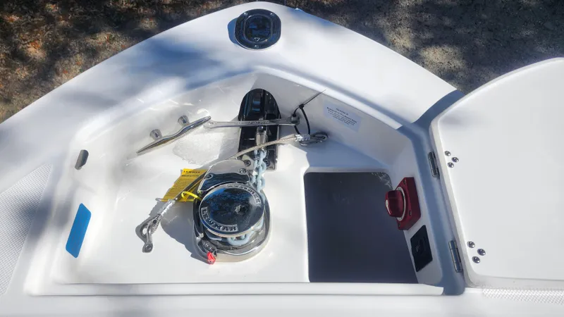  Yacht Photos Pics 2025 Regal LX6 boat anchor compartment with winch and storage area.