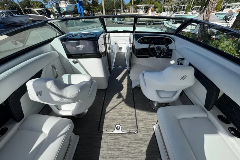  Yacht Photos Pics 2026 Four Winns HD8 OB boat interior with white seating and modern dashboard.
