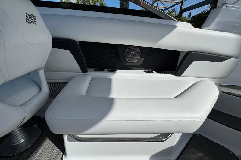  Yacht Photos Pics 2026 Four Winns HD8 OB boat interior with white seating and cup holders.