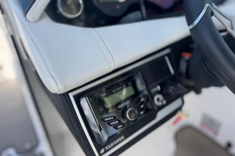  Yacht Photos Pics Close-up of 2026 Four Winns HD8 OB boat dashboard with steering wheel and control panel.