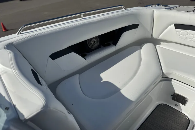  Yacht Photos Pics Interior seating of 2026 Four Winns HD8 OB boat, featuring white upholstery and speaker system.