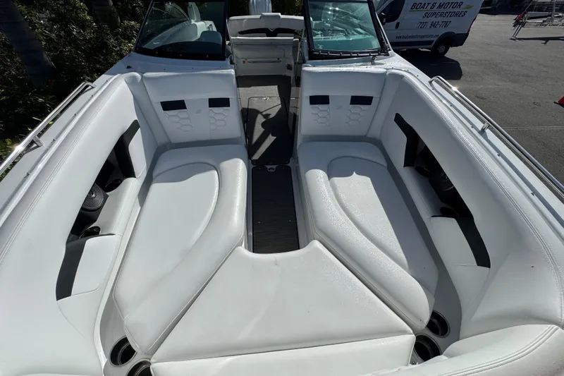  Yacht Photos Pics 2026 Four Winns HD8 OB boat interior with white seating and cup holders.